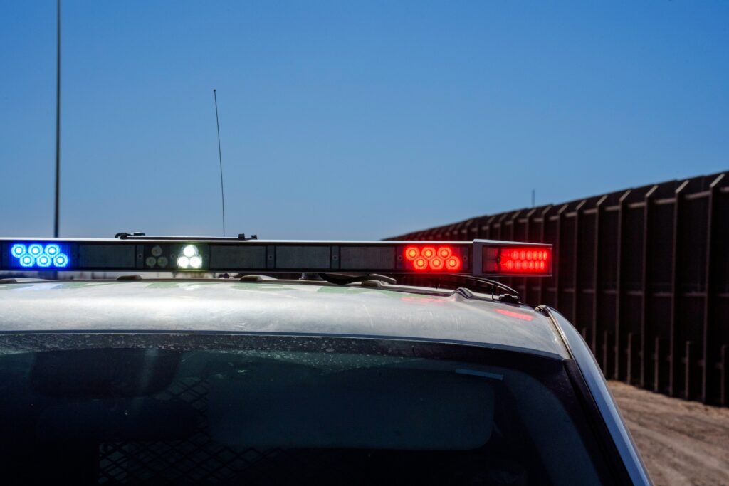 a police car pulling over a driver for suspected DUI